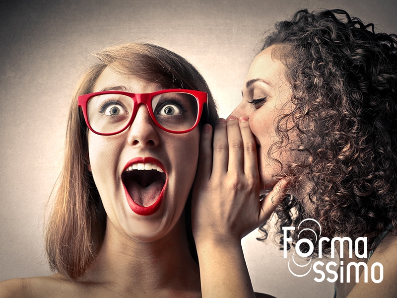 Girls whispering secrets